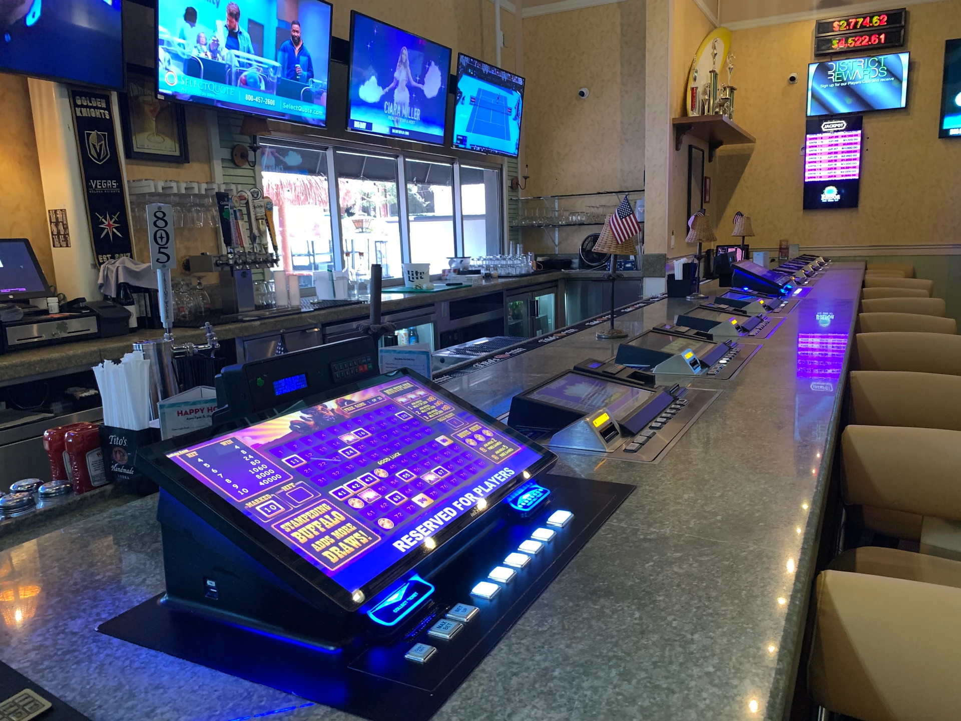 Balboa's bar with video poker machines, seating and televisions